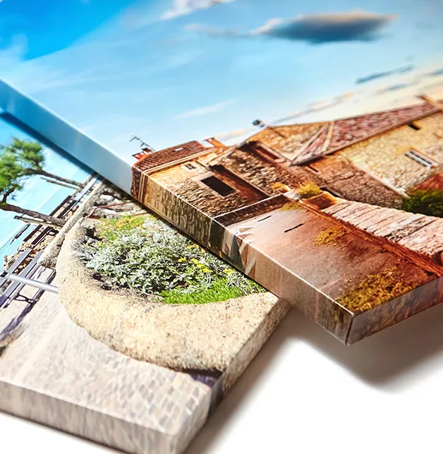 A canvas print being stretched over wooden bars in the studio